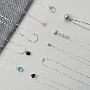 Collection of S925 sterling silver necklaces with heart and blue stone pendants