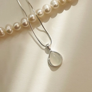 Elegant S925 sterling silver necklace with teardrop opal pendant on a snake chain