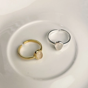 Minimalist 925 sterling silver ring with oval white chalcedony in gold and silver finish
