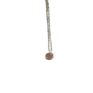 Minimalist S925 sterling silver necklace with a round brown crystal pendant on white background