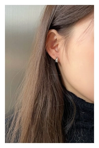 Polished S925 silver water drop earrings shown on model for a minimalist jewelry look