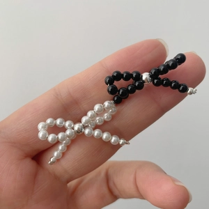 925 silver pearl bow stud earrings featuring black and white beaded aesthetic design
