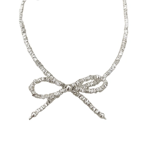 Elegant S925 sterling silver bow bracelet with textured beads and minimalist design