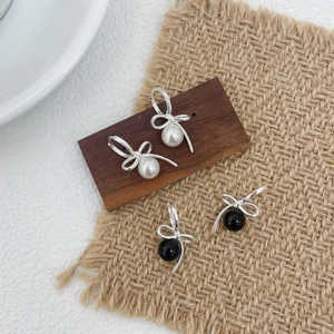 Elegant S925 sterling silver bow earrings with round black and white agate pearls
