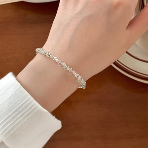 Elegant beaded S925 silver bracelet with rainbow glass beads worn on a wrist