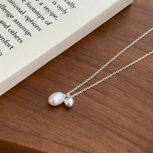 Elegant S925 silver necklace featuring a white freshwater pearl and polished silver bead
