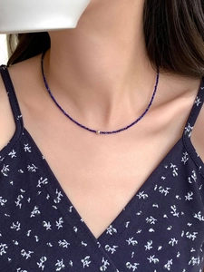 Close-up of S925 silver lapis lazuli choker with faceted blue beads and gold detail