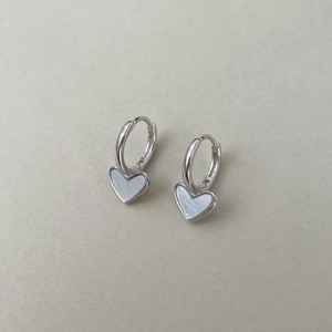 Detailed view of S925 silver heart huggie hoop earrings with white mother of pearl inlay