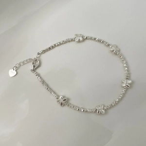 Detailed close-up of S925 sterling silver beaded bracelet with hollow butterfly charms