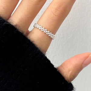 Minimalist S925 sterling silver beaded daisy ring on finger with elegant finish