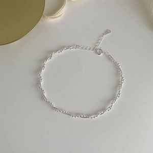 Detailed close-up of S925 sterling silver beaded bracelet with heart charm and extension chain
