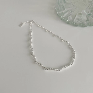 Detail of S925 sterling silver double-layer woven bracelet with shiny beads and clasp
