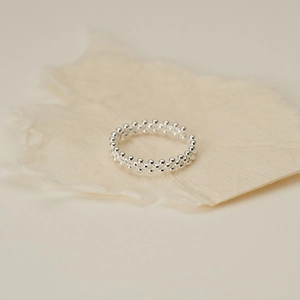 Detail of S925 sterling silver multi-layer beaded ring with textured woven silver dots