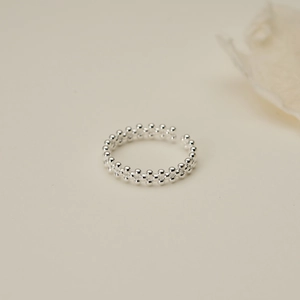 Macro shot of S925 silver double-layer beaded ring with adjustable open band design