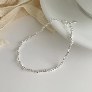 Detail view of S925 sterling silver woven double-layer bracelet with polished beads