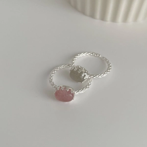 Detailed macro view of vintage S925 silver rings with pink and grey oval gemstones