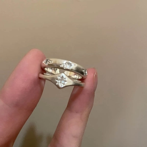Detailed close-up of a vintage S925 silver star ring set with matte brushed texture