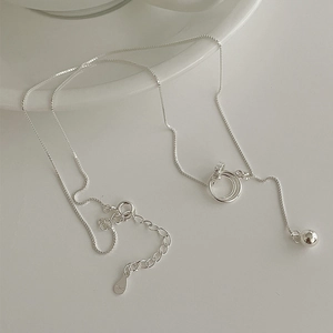 Minimalist S925 sterling silver interlocking rings necklace on a clean white background