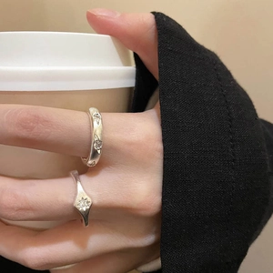 Minimalist S925 silver starburst rings with matte brushed finish on woman's hand