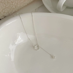 Detailed view of S925 sterling silver interlocking rings necklace with spherical bead drop