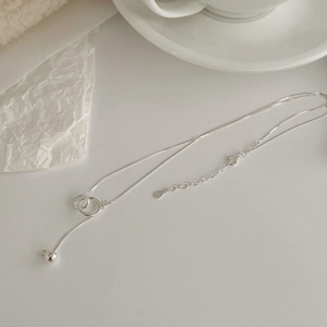 Detailed view of S925 sterling silver interlocking rings necklace on elegant background