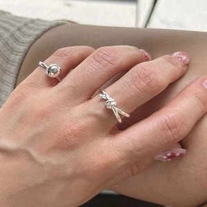 Minimalist S925 sterling silver knot and metal ball ring set worn on a finger