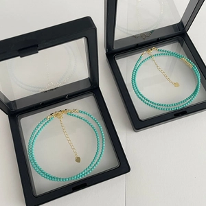Turquoise beaded necklace with golden heart pendant and extension chain in display box