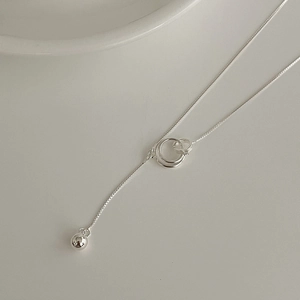 Close-up of S925 sterling silver interlocking rings necklace with a round bead pendant