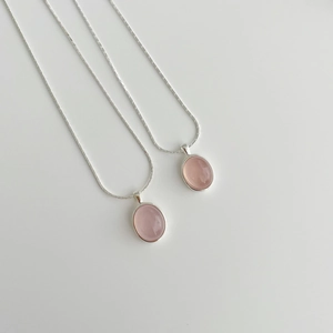 Detail of S925 sterling silver necklaces with pink chalcedony stones and snake bone chain
