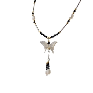 Retro handmade pearl necklace with black beads and a white butterfly pendant tassel