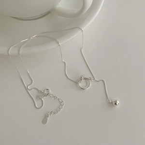 Close-up of S925 sterling silver interlocking rings and lobster clasp on link chain