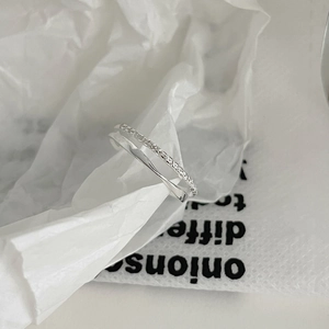 Detailed macro view of silver double-layered chain ring with sparkling pavé cubic zirconia