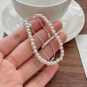 Elegant S925 sterling silver double-layer bracelet with round white pearls and silver beads