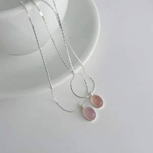 Detailed view of S925 sterling silver necklaces featuring pink chalcedony oval pendants