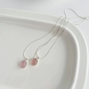Detail view of S925 sterling silver necklaces featuring pink chalcedony oval pendants