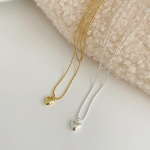 Minimalist S925 sterling silver layered heart necklace in polished gold and silver finish