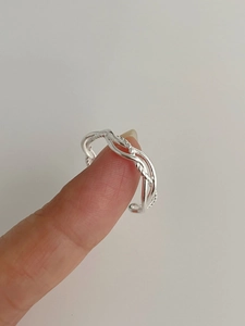 Detail of twisted multi-layer S925 sterling silver ring showing the braided weave design