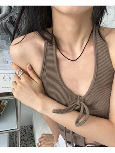 Close-up detail of 2mm black spinel beaded choker necklace on a model for a chic look