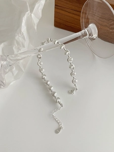 Detailed shot of S925 sterling silver beaded bracelet with brushed and polished textures