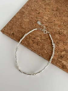 Detail of S925 sterling silver bamboo joint bracelet with heart tag and extension chain