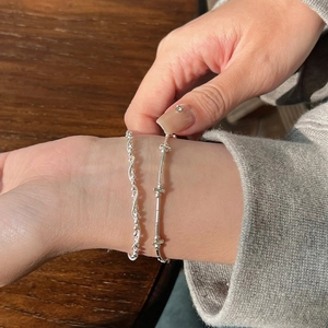 Close-up of S925 sterling silver twisted rope and bamboo style chain bracelet set