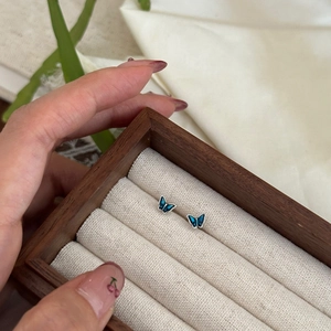 Minimalist 999 silver butterfly stud earrings with blue-green gradient enamel finish