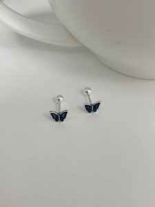 Detailed macro view of 925 silver butterfly earrings with blue enamel and screw back design