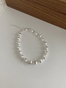 Detail of S925 sterling silver beaded bracelet showing matte texture and lobster clasp