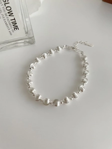 Detailed close-up of S925 sterling silver beaded bracelet with brushed texture and lobster clasp