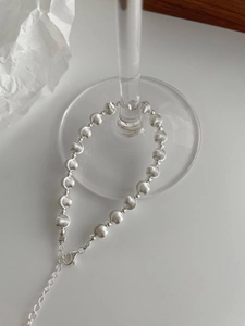 Close-up of S925 sterling silver beaded bracelet featuring matte brushed silk texture detail