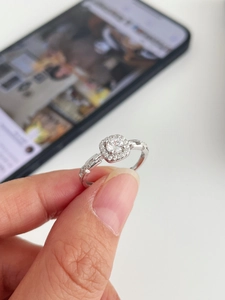 Macro detail of S925 sterling silver halo ring featuring a round center stone with micro-pavé
