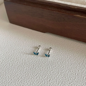 Detailed close-up of blue butterfly stud earrings with secure screw-back closures