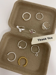 Detailed set of S925 sterling silver rings with faux pearls and floral charms