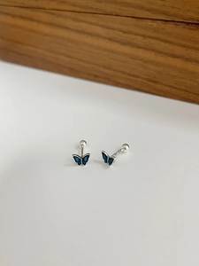 Close-up of blue enamel butterfly studs with S925 silver stamp and screw back closure